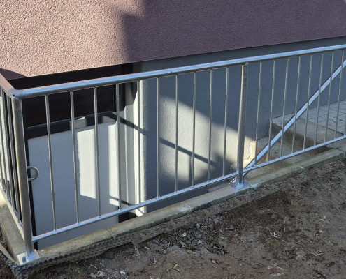 Geländer mit Handlauf an einem Treppenhals